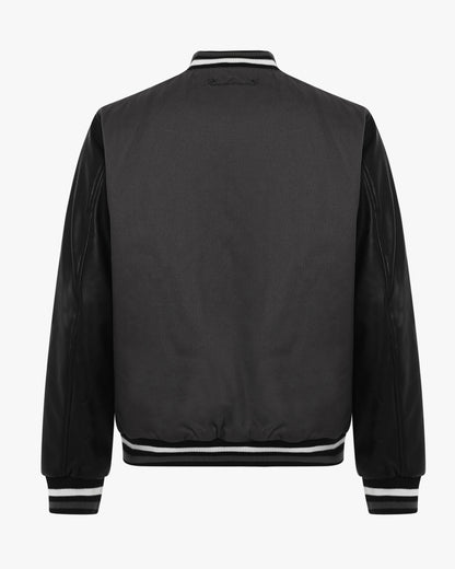 Varsity jacket in two materials with zip and patch